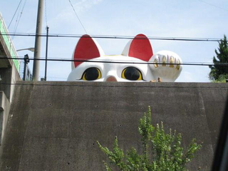Illustration for article titled Attack on Giant Lucky Cat